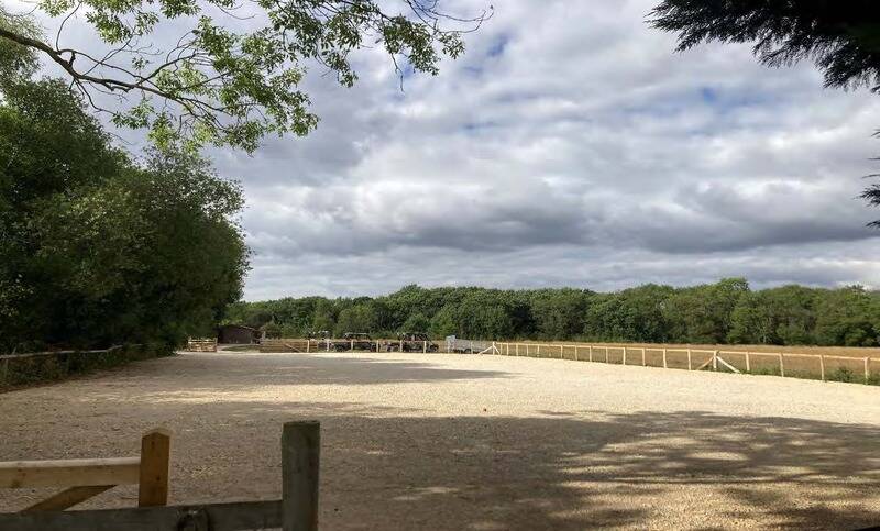 Car park looking up to Campsite Field and Welfare Unit